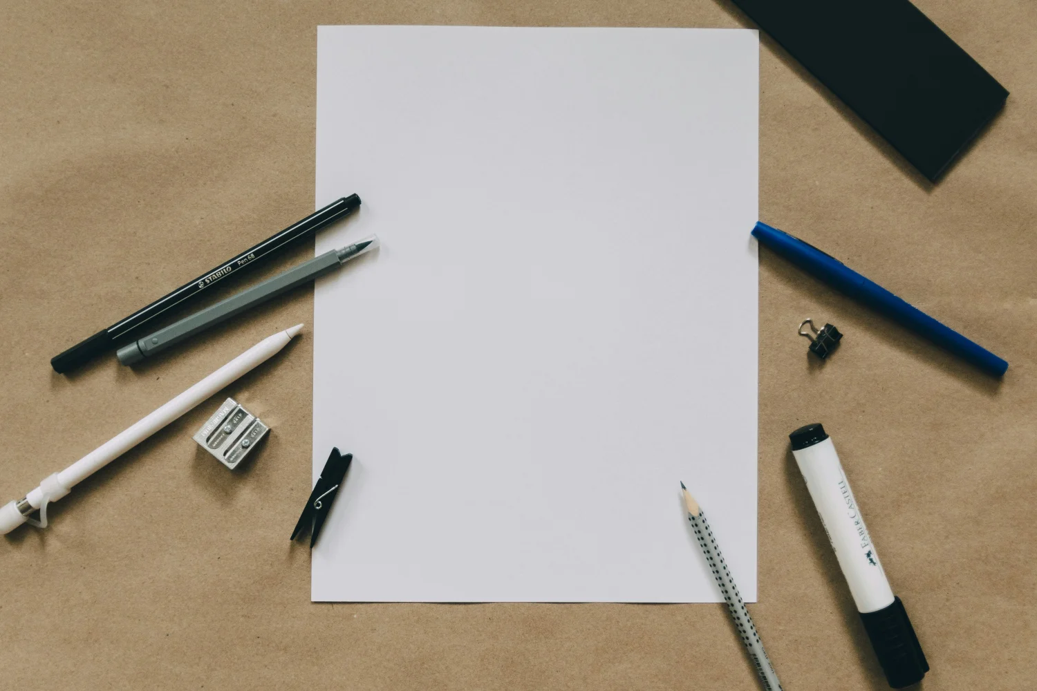 pens and pencils on plain paper